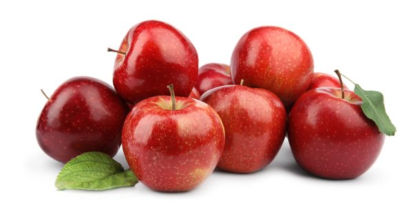 Ripe juicy red apples with leaves on white background