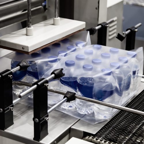 Shrink film wrapping machine for bottle of water