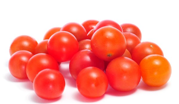 closeup of some cherry tomatoes on a white background
