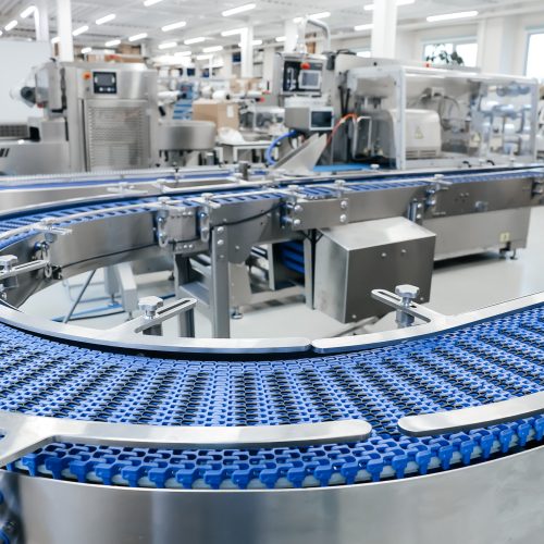 Empty modern conveyor belt of production line, part of industrial equipment in factory plant. Automatic system line
